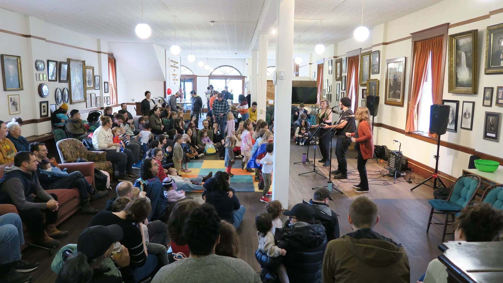Children and their grown-ups enjoying a live Little Beats concert together